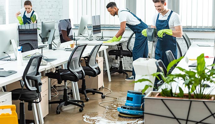 A professional team cleaning office space.