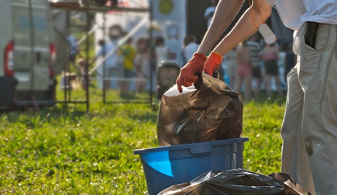 A person performing cleanup service after concert