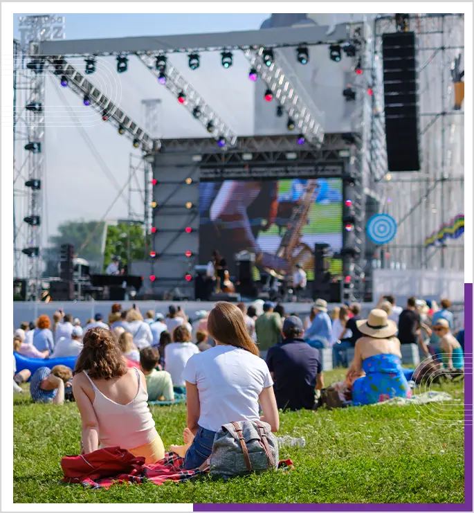 people gathered at an outdoor concert