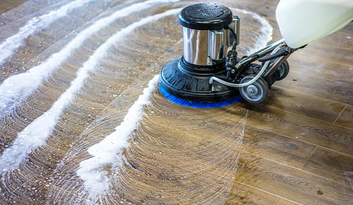 Wood floor cleaning using industrial cleaning machine