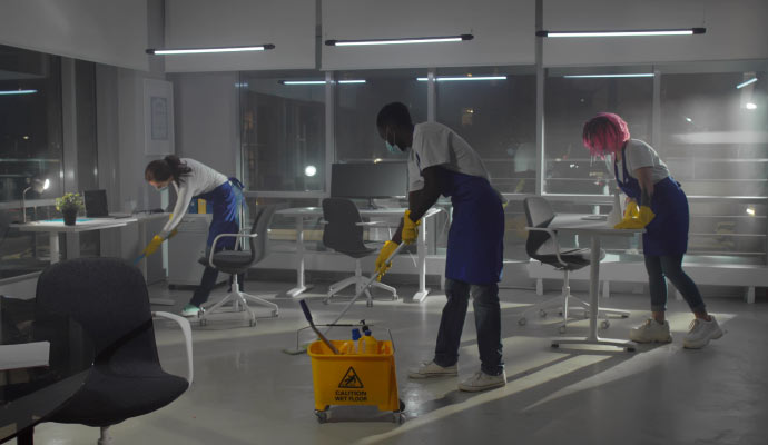 A team cleaning the office at night